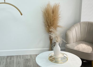 Elegant seating area at Tabitha Tweaks, Skelmersdale, England, GB featuring a plush chair and stylish decor.