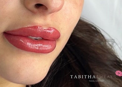 Close-up of glossy, enhanced lips at Tabitha Tweaks, Skelmersdale, England, GB.