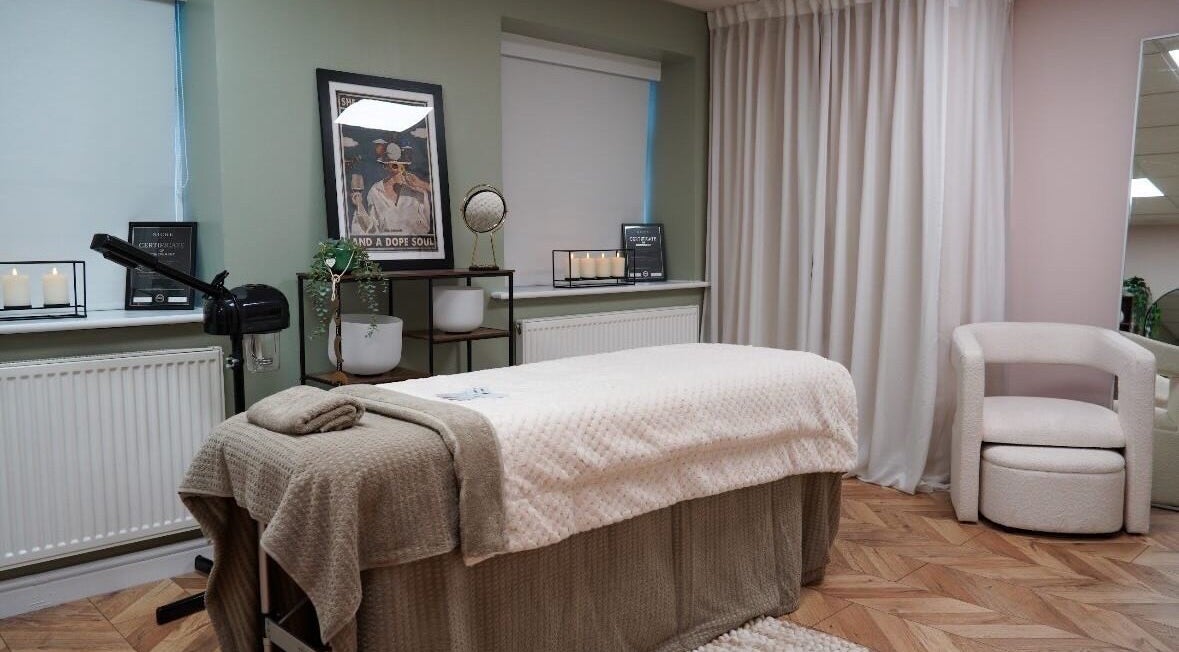 Relaxing spa treatment room at Bykiraquigley in Manchester, England, GB, featuring cozy decor and soft lighting.