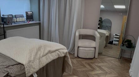 Tranquil spa room at Bykiraquigley, Manchester, England, GB, featuring a plush bed and elegant decor.