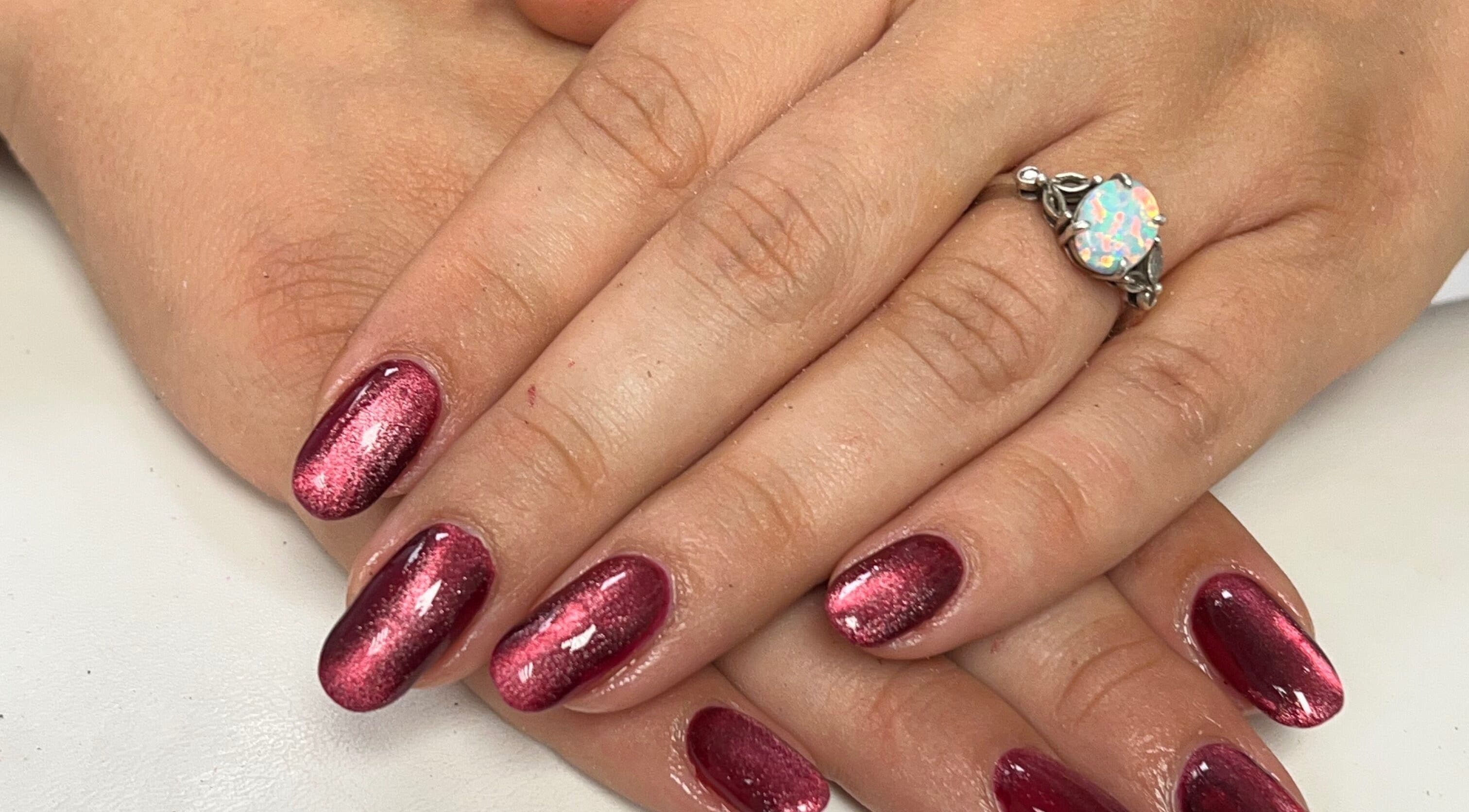 Gleaming ruby nails at The Nail Studio By Kim, located in Leek, England, GB, showcasing expert manicure.