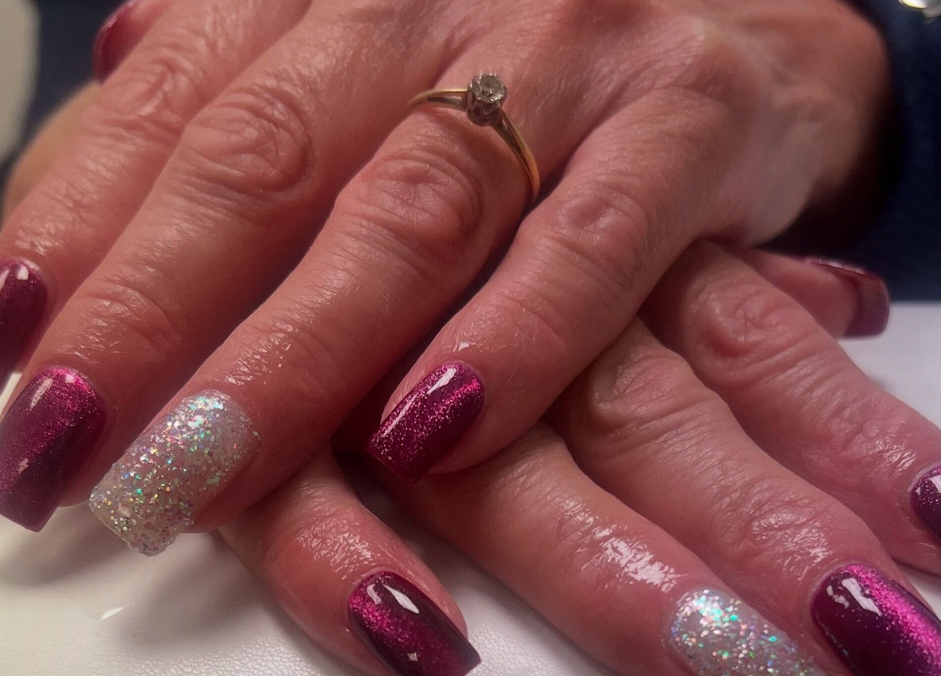 Elegant purple and glitter nail art at The Nail Studio By Kim, Leek, England, GB.