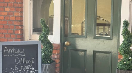 Entrance of Cutthroat & Hound (the Archway) in Aylesbury, England, GB with stylish decor.