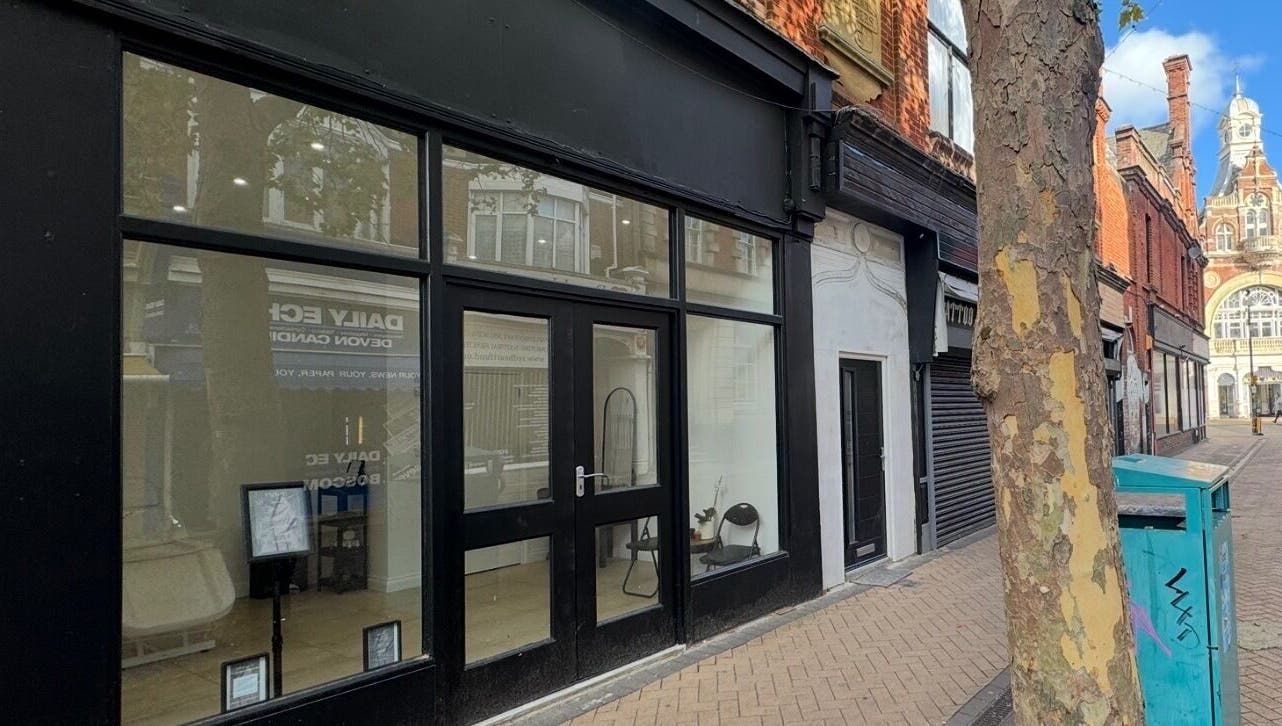 Exterior view of Dolls Beauty Lab located in Bournemouth, England, GB, along a charming street.