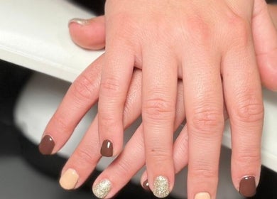 Elegant manicure at Nails at the Barn, Earls Colne, England, GB featuring brown and gold shades.