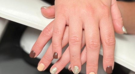 Elegant manicure at Nails at the Barn, Earls Colne, England, GB featuring brown and gold shades.