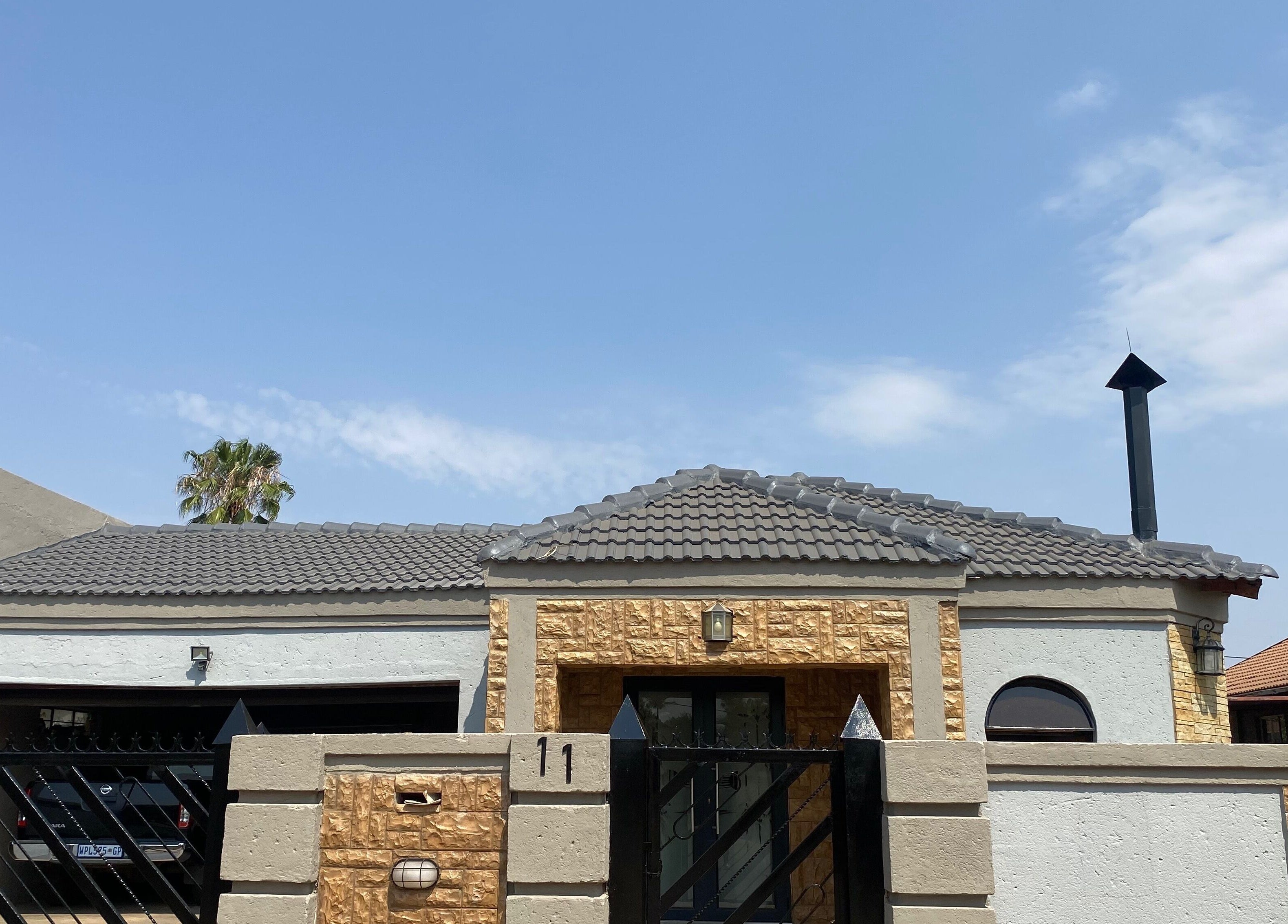 Elegant exterior of Clawed._ in Akasia, Gauteng, ZA with modern architectural design.