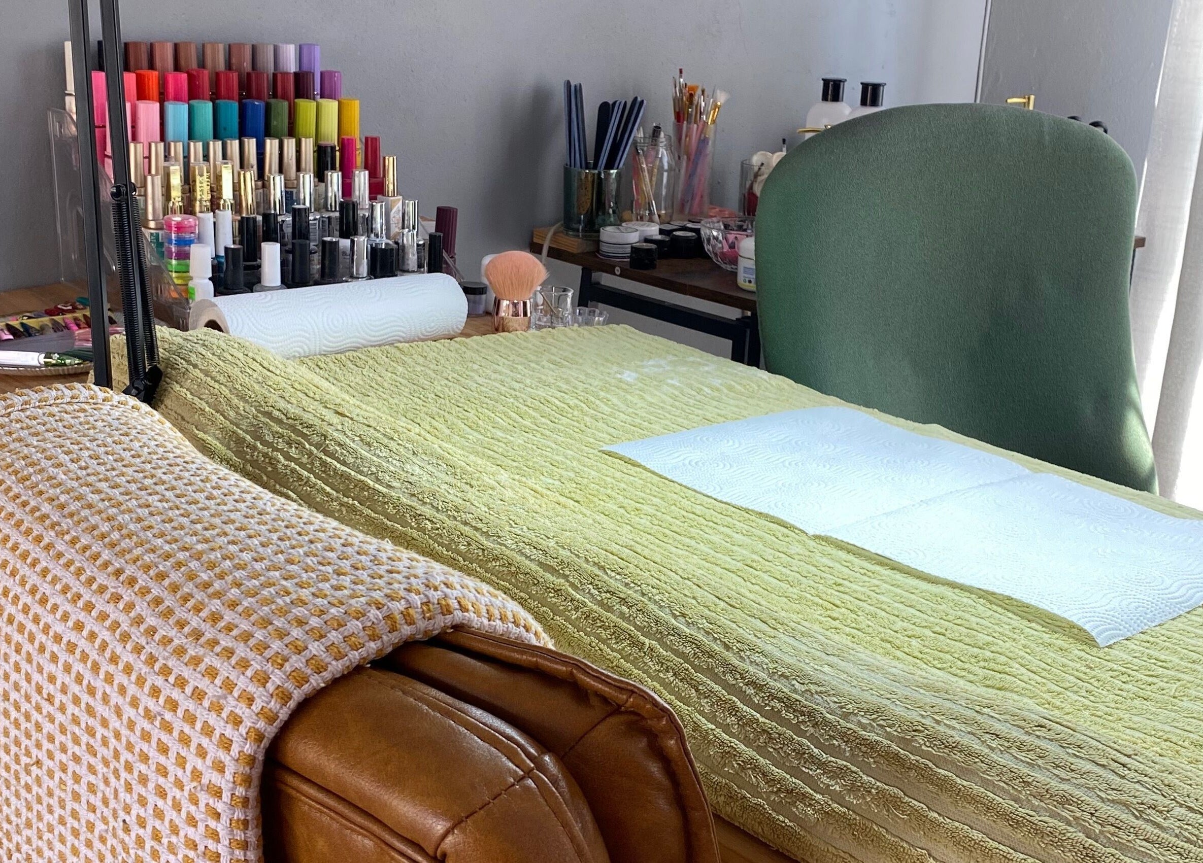 Manicure station at Clawed._ showcasing vibrant nail polishes in Akasia, Gauteng, ZA.