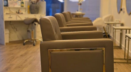 Luxurious salon chairs at LLP hair design, Clay Cross, England, GB, showcasing a stylish and comfortable setting.