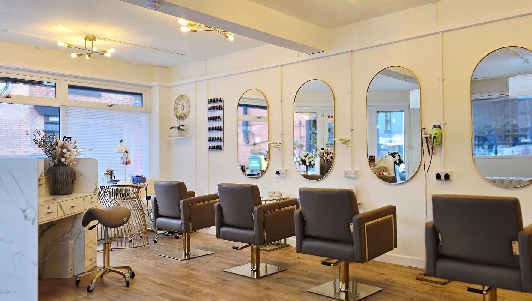 LLP hair design chic interior in Clay Cross, England, GB featuring spacious styling stations and modern decor.