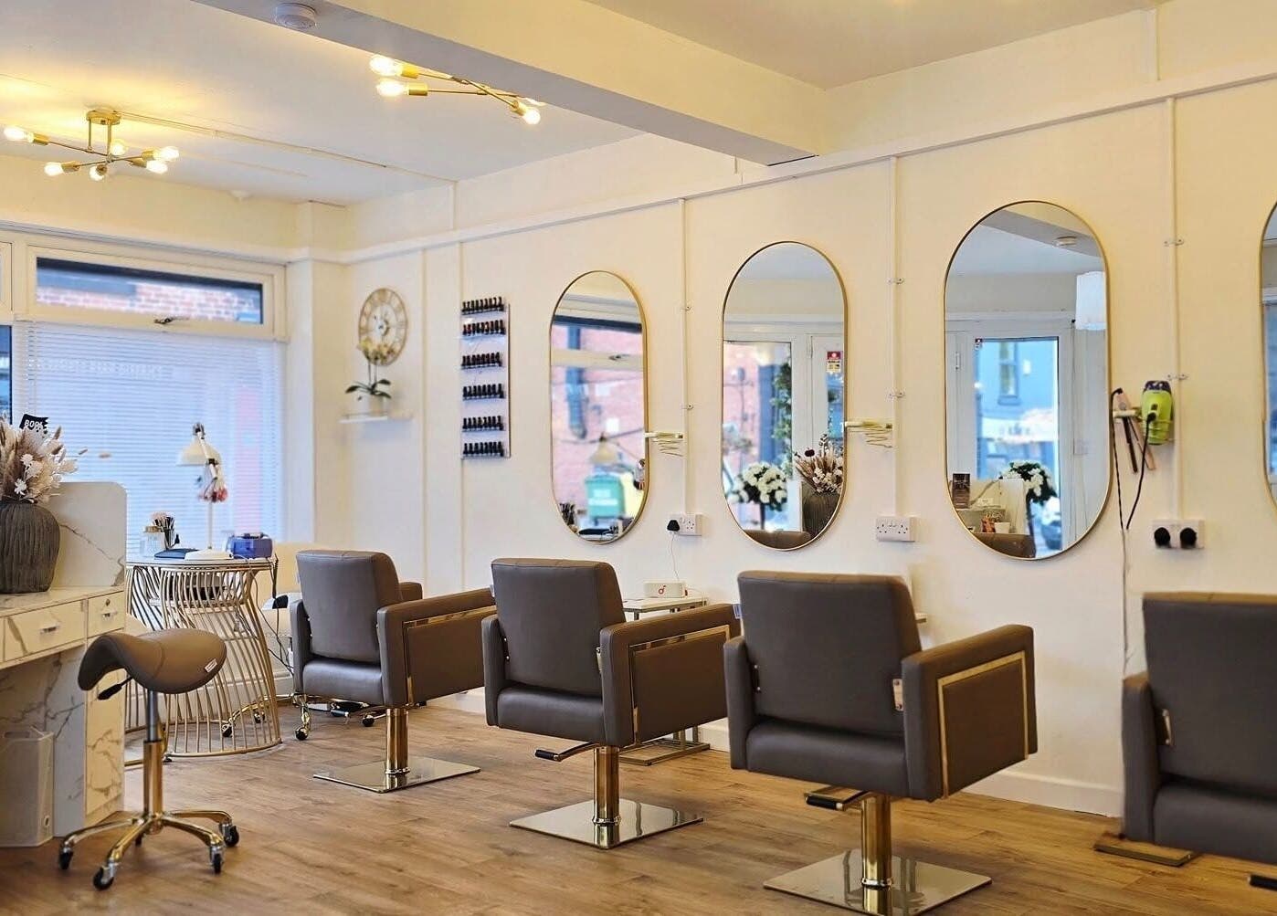 LLP hair design chic interior in Clay Cross, England, GB featuring spacious styling stations and modern decor.