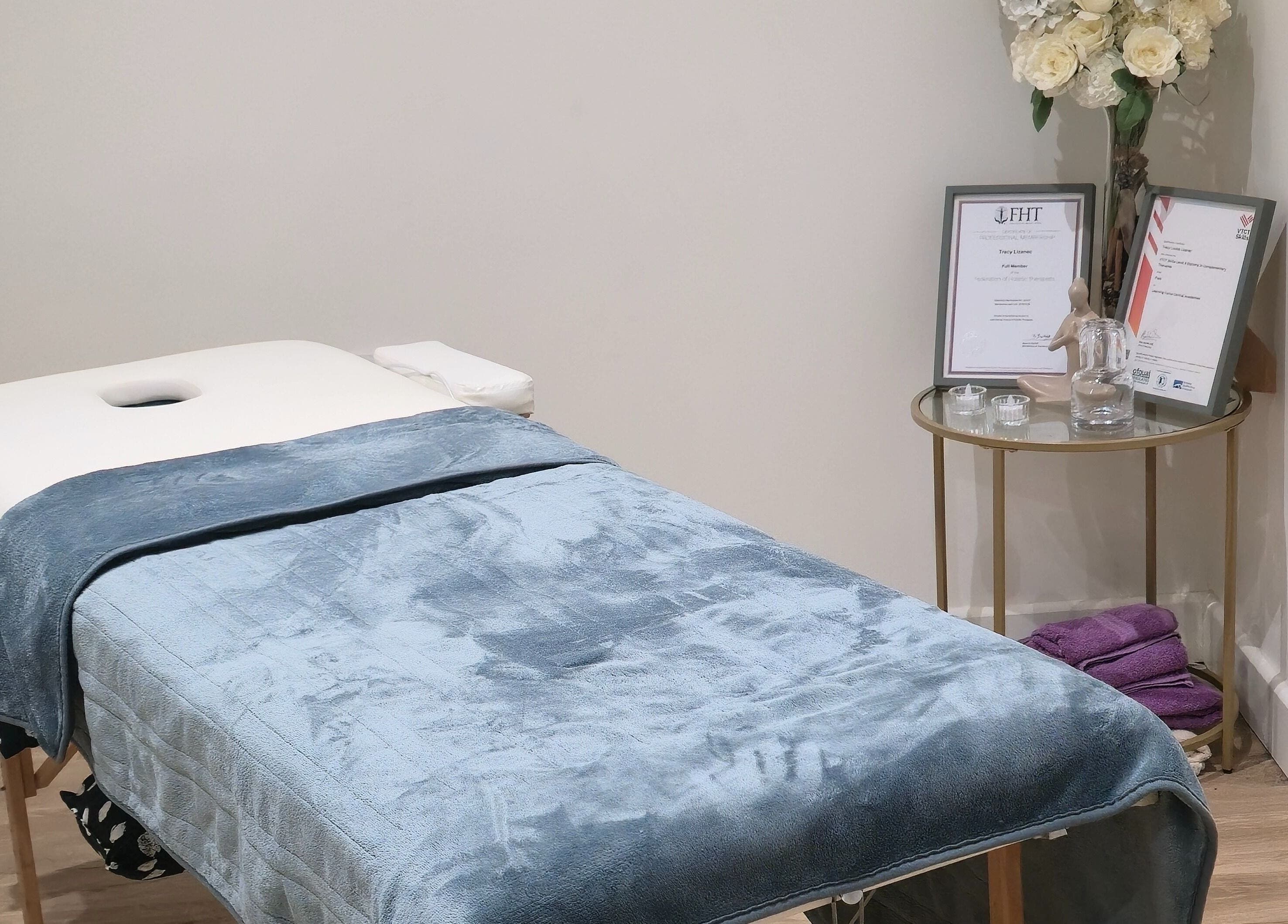 Tranquil massage room at LLP Hair Design, Clay Cross, England, GB, showcasing an inviting treatment bed.