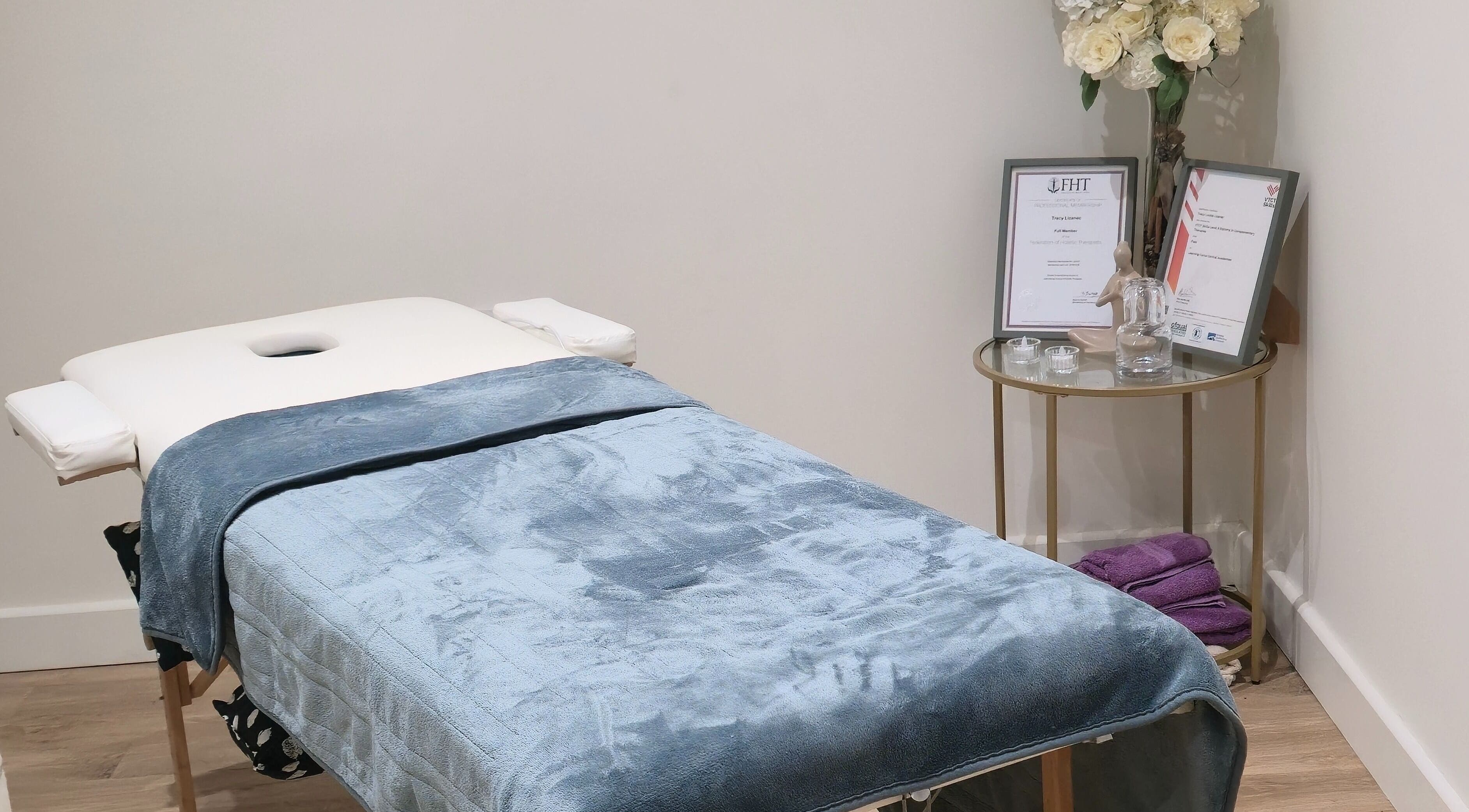 Tranquil massage room at LLP Hair Design, Clay Cross, England, GB, showcasing an inviting treatment bed.