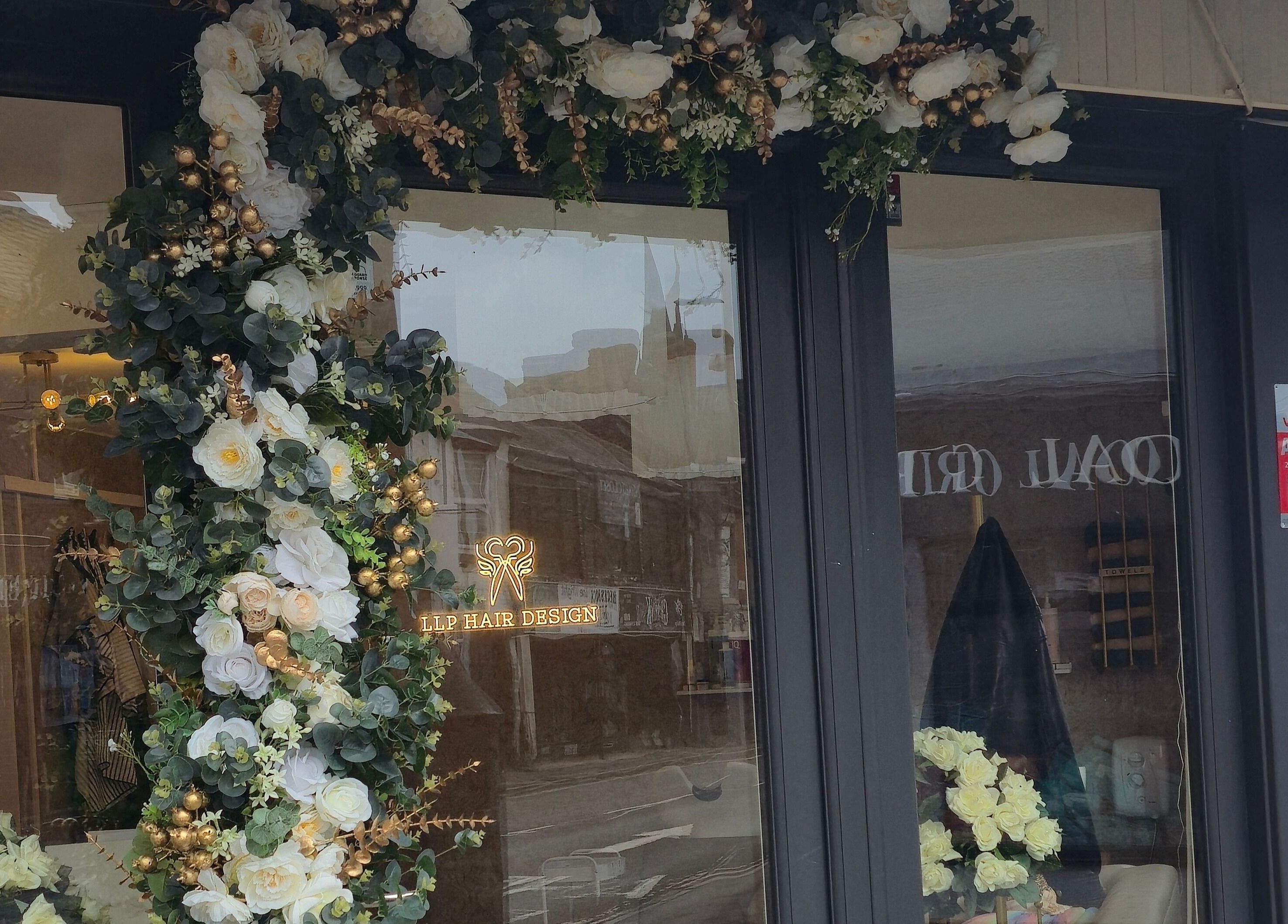 LLP hair design facade adorned with lush floral decor in Clay Cross, England, GB.