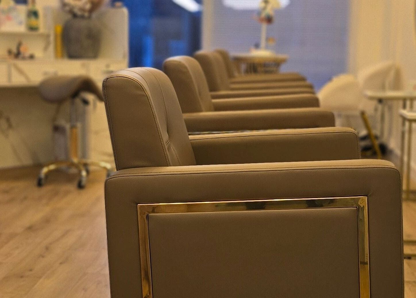 Stylish salon chairs at LLP hair design, Clay Cross, England, GB, offering comfort and modern design.