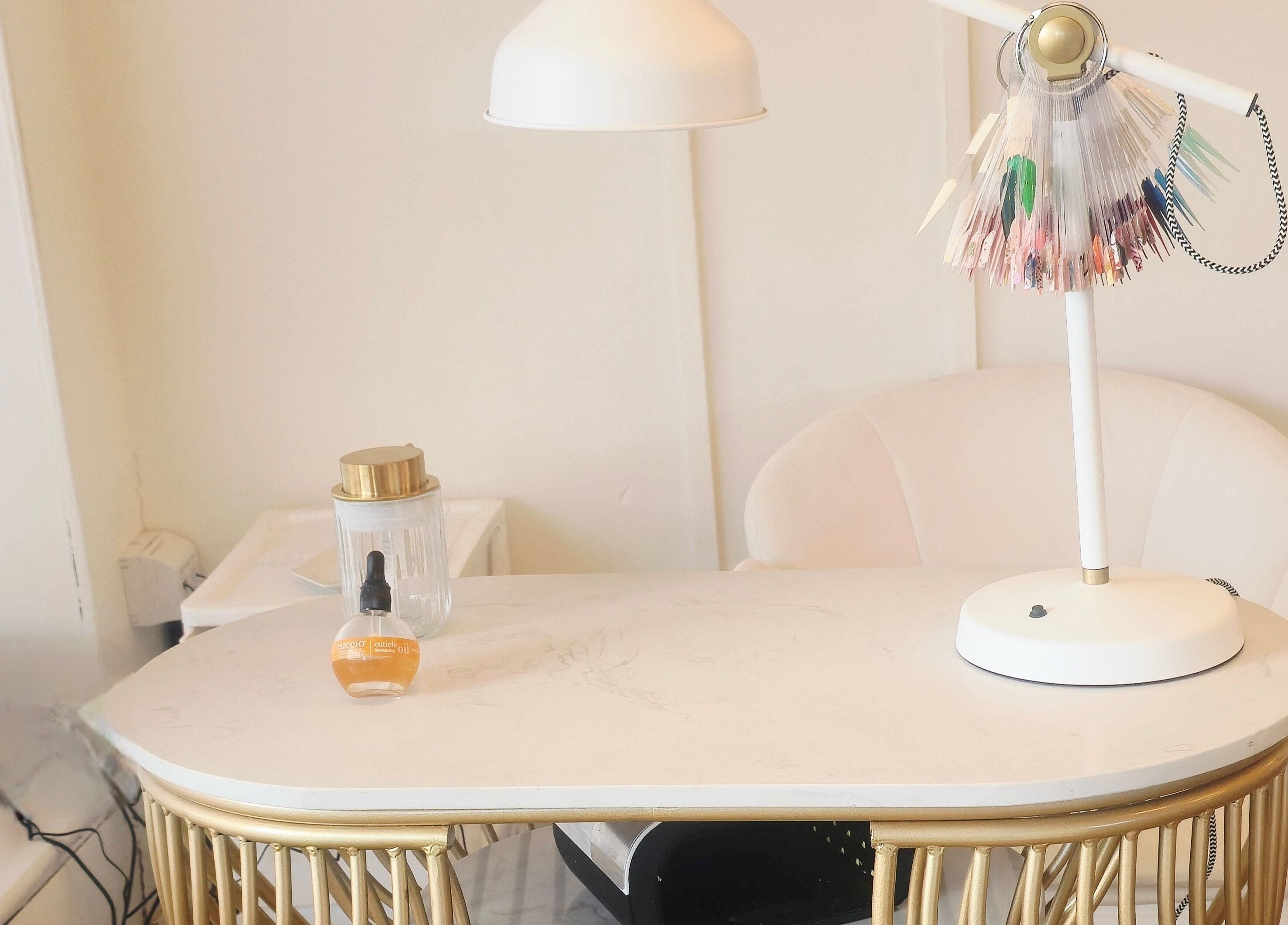 Elegant nail station at LLP hair design, Clay Cross, England, GB, showcasing manicure tools and sleek decor.