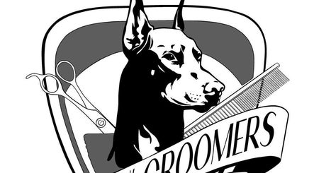 Bros N' Groomers logo featuring scissors and a comb in Lemesos, Lemesos, CY. Stylish and professional design.