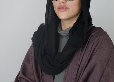 Stylish individual at High End Aesthetics, London, England, GB, showcasing modern elegance.
