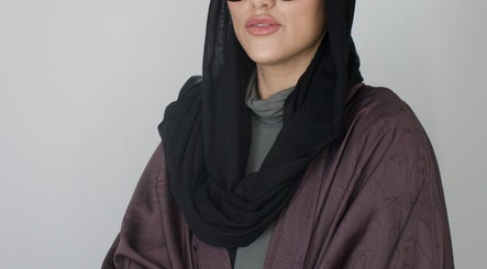 Stylish individual at High End Aesthetics, London, England, GB, showcasing modern elegance.