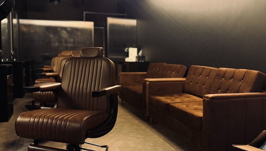 Luxurious barbershop interior with brown leather chairs at Brocave Groomers, Dubai, Dubai, AE.