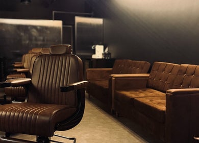 Luxurious barbershop interior with brown leather chairs at Brocave Groomers, Dubai, Dubai, AE.