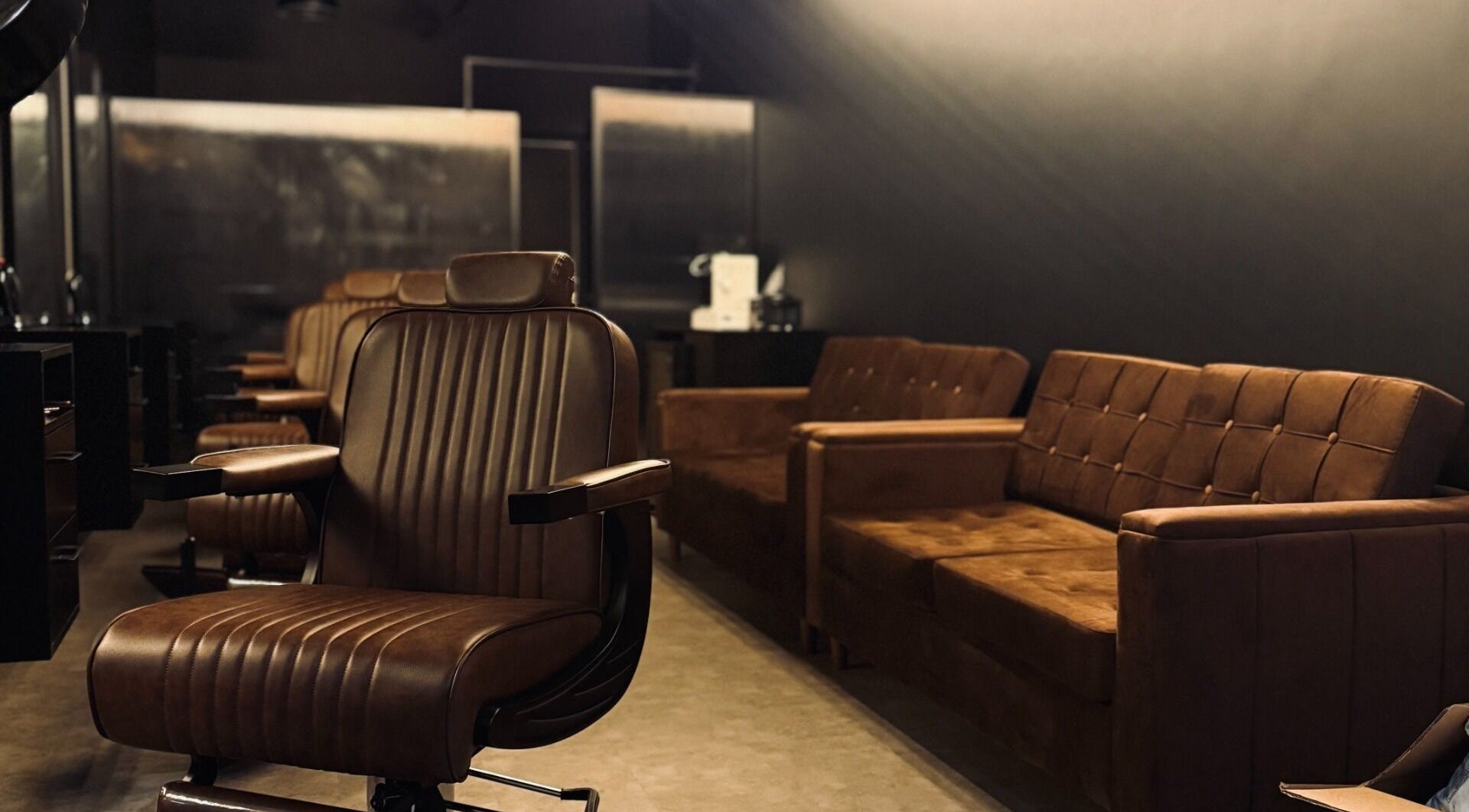 Luxurious barbershop interior with brown leather chairs at Brocave Groomers, Dubai, Dubai, AE.