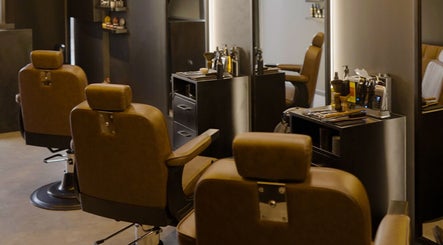 Chic interior of Brocave Groomers in Dubai, Dubai, AE showcasing stylish barber chairs and grooming tools.
