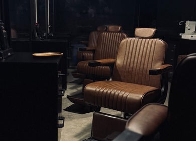 Elegant barber chairs at Brocave Groomers, Dubai, Dubai, AE, showcasing premium grooming experience.