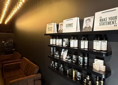 Elegantly designed interior of Brocave Groomers in Dubai, Dubai, AE featuring grooming products on shelves.