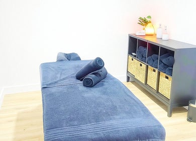 Relaxing massage room with cozy decor at Vital Restore, London, England, GB.