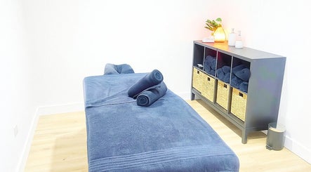 Relaxing massage room with cozy decor at Vital Restore, London, England, GB.