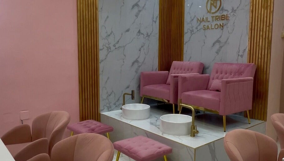 Elegant pedicure section with pink chairs at Nail Tribe Salon, Kingston, St. Andrew Parish, JM.