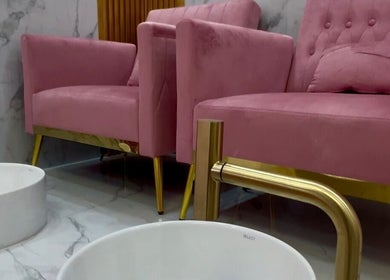 Pink velvet pedicure chairs at Nail Tribe Salon, Kingston, St. Andrew Parish, JM, offering luxurious nail services.