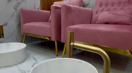 Pink velvet pedicure chairs at Nail Tribe Salon, Kingston, St. Andrew Parish, JM, offering luxurious nail services.