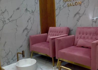 Elegant pink chairs at Nail Tribe Salon, Kingston, St. Andrew Parish, JM. A relaxing pedicure setting awaits.