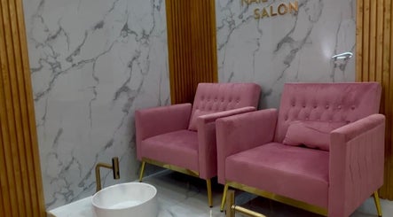 Elegant pink chairs at Nail Tribe Salon, Kingston, St. Andrew Parish, JM. A relaxing pedicure setting awaits.