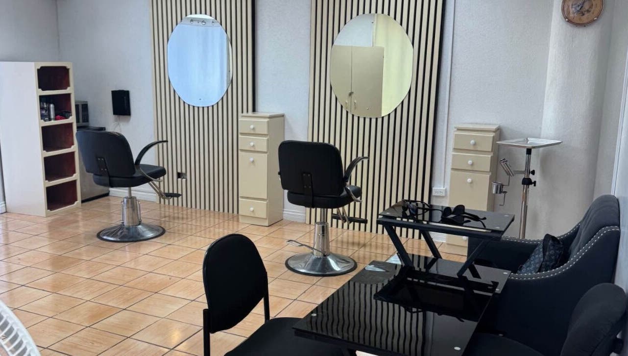 Modern salon interior at Aura Beauty Hair & Nails, Bridgetown, Saint Michael, BB featuring styling chairs and mirrors.