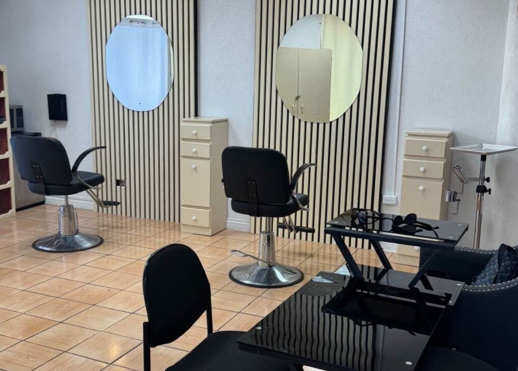 Modern salon interior at Aura Beauty Hair & Nails, Bridgetown, Saint Michael, BB featuring styling chairs and mirrors.