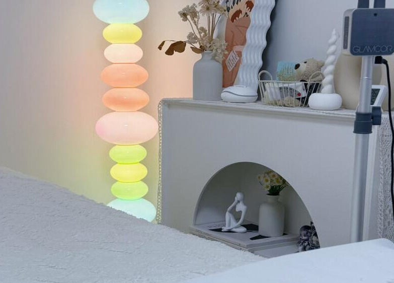 Tranquil treatment room at Jusjollie, Singapore, SG, with soft lighting and modern decor.