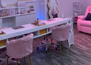 Elegant nail salon interior with pink chairs at Fresh Pressed in Singapore, Singapore, SG.