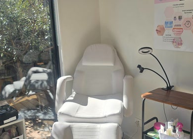 Relaxing treatment room at Bella'sBeauty, Christchurch, Canterbury Region, NZ, featuring a plush chair.