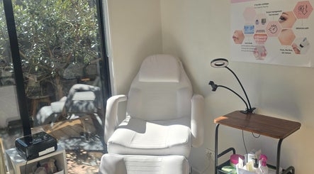 Relaxing treatment room at Bella'sBeauty, Christchurch, Canterbury Region, NZ, featuring a plush chair.