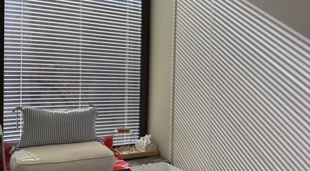 Relaxing seating area at Onyu Nail Studio, Sydney, New South Wales, AU, with natural light and plush cushion.