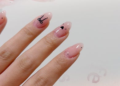Elegant nail art design at Onyu Nail Studio, Sydney, New South Wales, AU featuring artistic black accents.