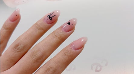 Elegant nail art design at Onyu Nail Studio, Sydney, New South Wales, AU featuring artistic black accents.