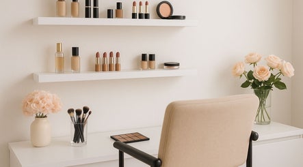 Chic beauty setup at makeupbymiri.au, Oran Park, New South Wales, AU with makeup products and flowers.