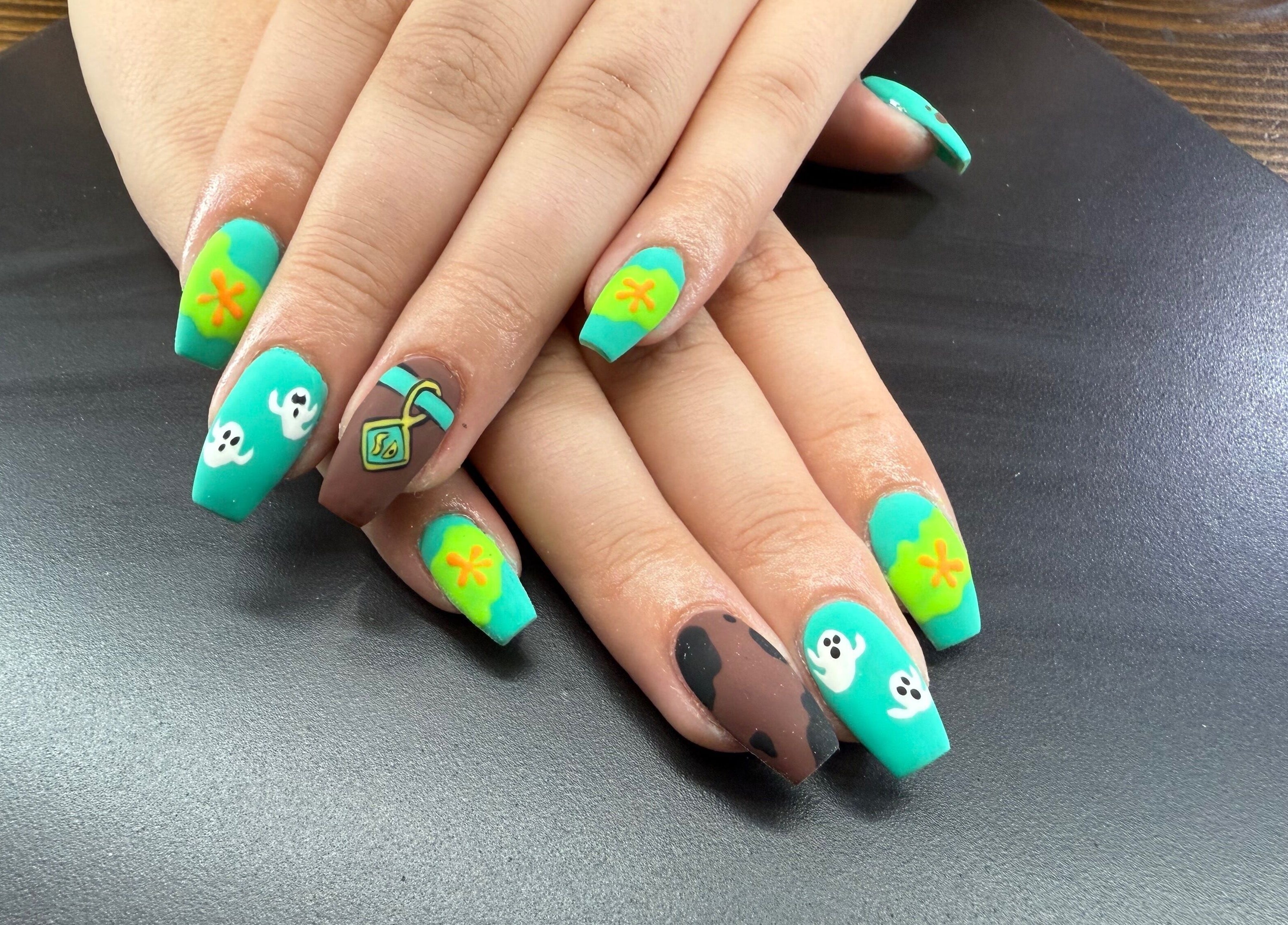 Colorful nail art design at Glam By Leigh in Washington, Utah, US showcasing creative manicure styles.