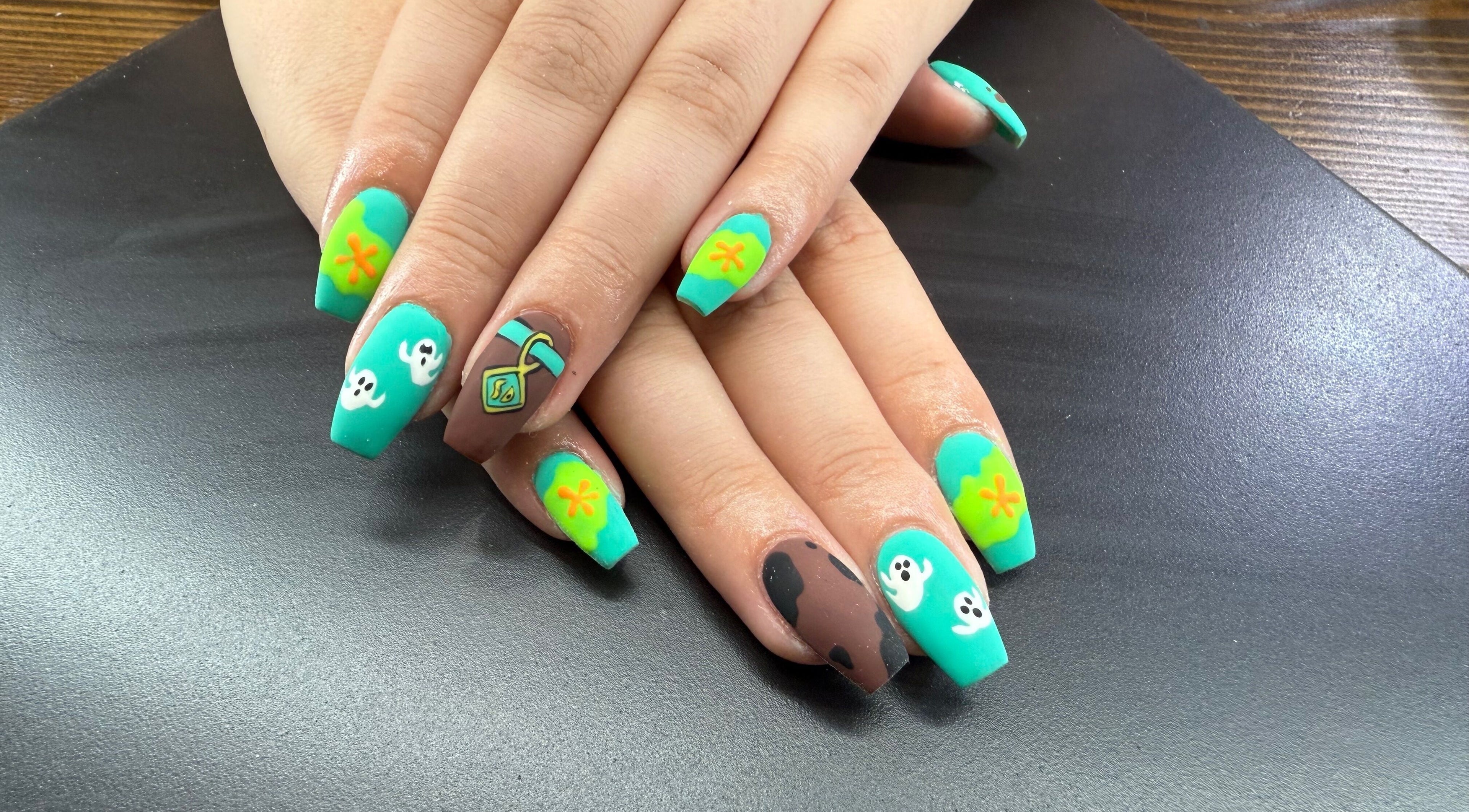 Colorful nail art design at Glam By Leigh in Washington, Utah, US showcasing creative manicure styles.