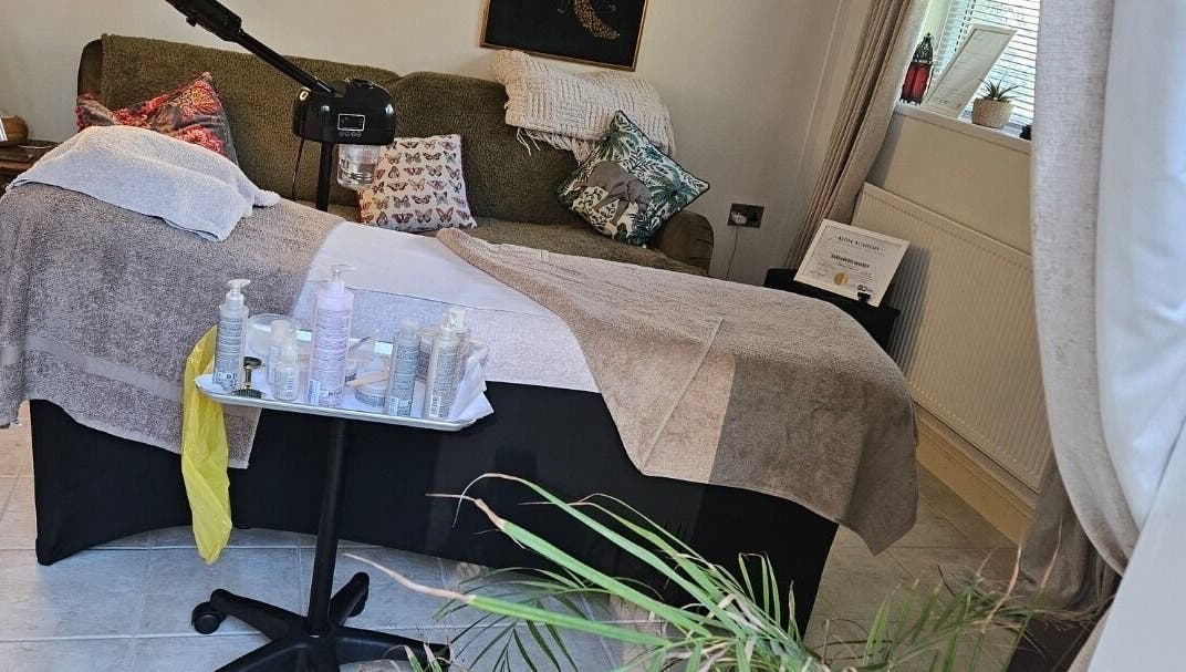 Tranquil treatment room at ELM Skin & Brows, Llantwit Major, Wales, GB, featuring a comfortable therapy bed.