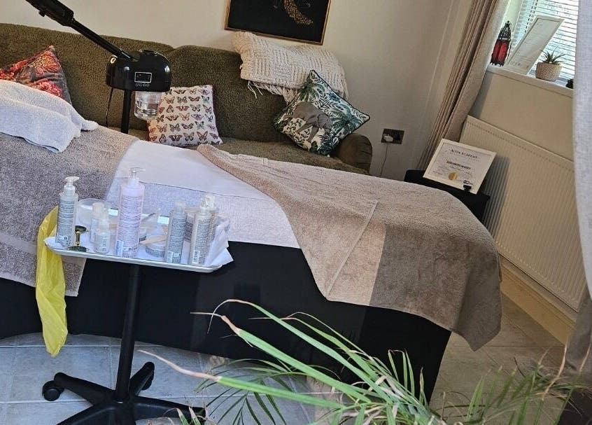 Tranquil treatment room at ELM Skin & Brows, Llantwit Major, Wales, GB, featuring a comfortable therapy bed.